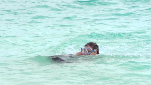 Close Shot Of Happy Young Woman Drifiting On Water Surface