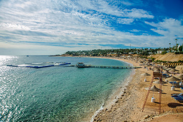 beautiful beach in red sea with green blue azur water and nice blue sky