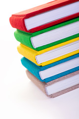 Multicolored book textile cover. Photobooks on a white background.