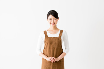 young asian woman wearing apron nurse isolated on white background