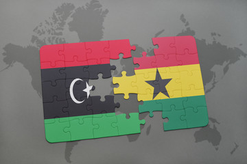 puzzle with the national flag of libya and ghana on a world map