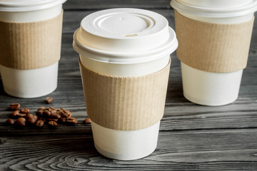 coffee cup to go at wooden background