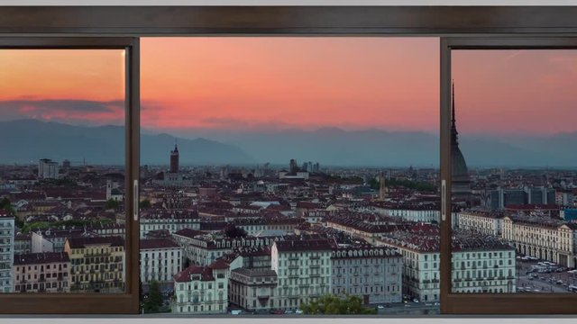 turin skyline panoramic view timelapse from day to night seen through sliding window