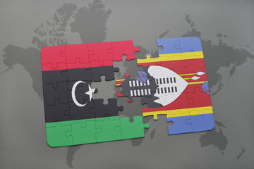 puzzle with the national flag of libya and swaziland on a world map