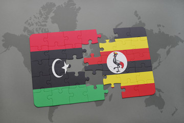 puzzle with the national flag of libya and uganda on a world map
