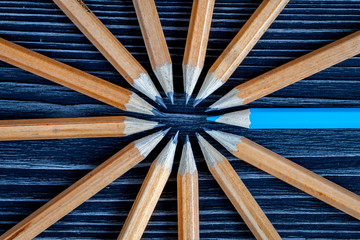 concept selection options with pencils on wooden background top view