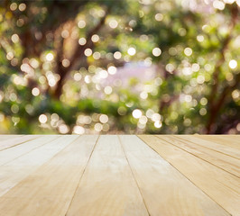 Jointed wood table top on Xmas New Year theme green bokeh 