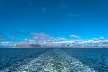 Clouds blue sky and ship track in Atlantic ocean, summer