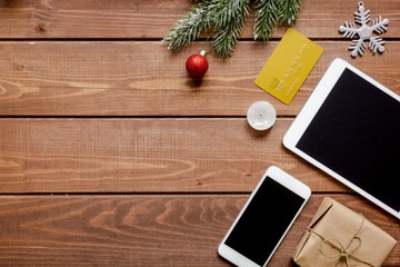 smartphone, tablet, shopping for new year online wooden table