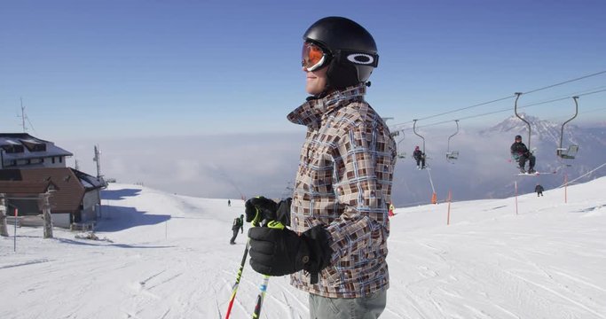 Slow Motion  Portrait Shot Of Skier Inviting To Skiing On Sunny Winter Day 