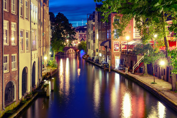 Canal Oudegracht in the night colorful illuminations in the blue hour, Utrecht, Netherlands. Used toning
