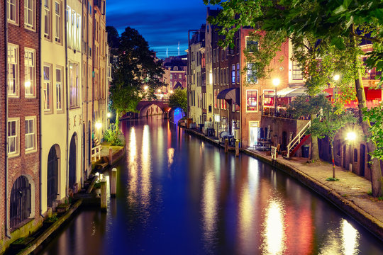 Canal Oudegracht in the night colorful illuminations in the blue hour, Utrecht, Netherlands. Used toning