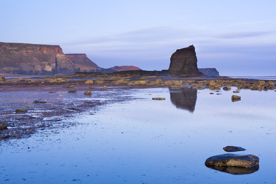 Early morning light on Black Nab and the cliffs of Saltwick Bay, North Yorkshire, Yorkshire