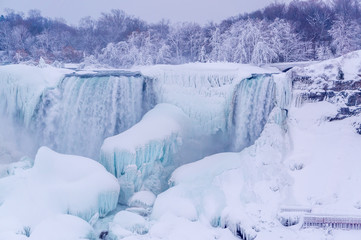 Fototapeta na wymiar American Falls covered with ice and snow, Niagara Falls, USA