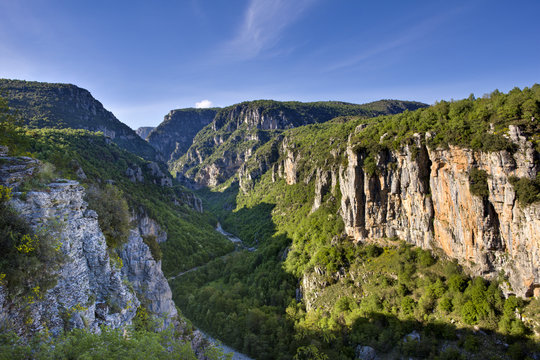 Looking down in the early evening onto the more open stretches of the Vikos Gorge, near Vitsa and the Misius Bridge in spring, Epirus, Greece