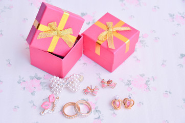 Earrings, flower boxes on the floor.
