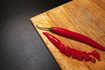 red chili peppers on wooden cutting board