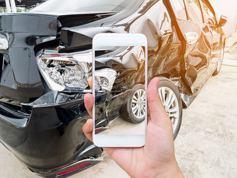 female hold mobile smartphone photographing car accident