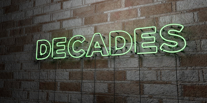 DECADES - Glowing Neon Sign on stonework wall - 3D rendered royalty free stock illustration.  Can be used for online banner ads and direct mailers..