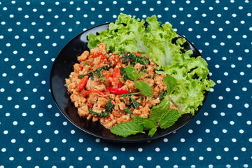 Fried spicy basil with minced pork topped lettuce.