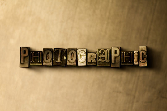 PHOTOGRAPHIC - close-up of grungy vintage typeset word on metal backdrop. Royalty free stock illustration.  Can be used for online banner ads and direct mail.