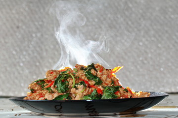 Aroma smell fried spicy basil with minced pork topped lettuce.