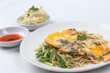 Close up oyster omelet with herb call Hoi Tod Khai.