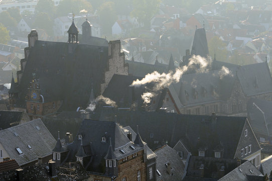 Rooftops of medieval buildings in Marburg, including Town Hall and Old University on a cold, misty autumn morning, Marburg, Hesse, Germany