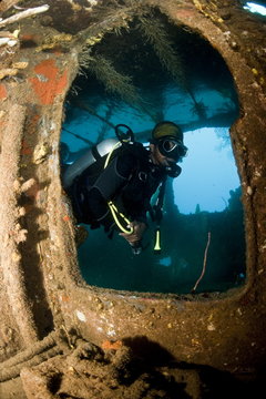 Diver inside the wreck of the Lesleen M freighter, sunk as an artificial reef in 1985 in Anse Cochon Bay, St. Lucia