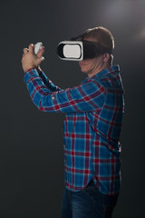 Man wearing virtual reality glasses,studio shot