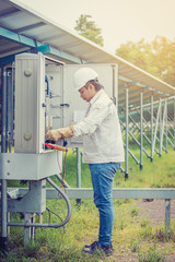 engineer working on checking and maintenance equipment in solar power plant