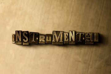 INSTRUMENTAL - close-up of grungy vintage typeset word on metal backdrop. Royalty free stock illustration.  Can be used for online banner ads and direct mail.