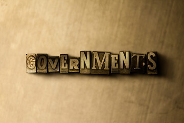 GOVERNMENTS - close-up of grungy vintage typeset word on metal backdrop. Royalty free stock illustration.  Can be used for online banner ads and direct mail.