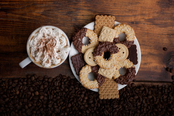 Cup of Coffee with whipped cream and homemade cookies