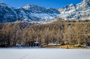 Frozen Lago Blu with chalet in background