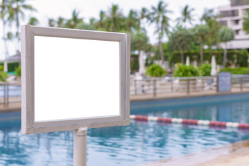 empty of sign standing near a swimming pool