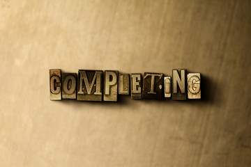 Fototapeta premium COMPLETING - close-up of grungy vintage typeset word on metal backdrop. Royalty free stock illustration. Can be used for online banner ads and direct mail.