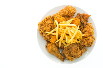 Fried chicken and french fries in white plate