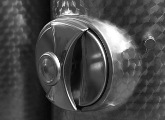 Stainless steel reservoir for wine, closeup