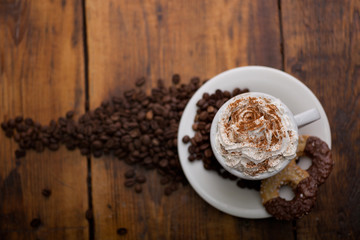 Cup of Coffee with whipped cream and homemade cookies