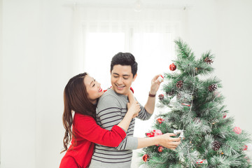 Christmas. Asian Couple Lovers Celebrating New Year at Home.