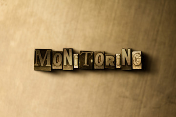 MONITORING - close-up of grungy vintage typeset word on metal backdrop. Royalty free stock illustration.  Can be used for online banner ads and direct mail.