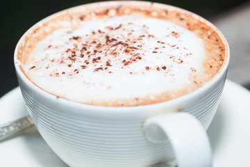 hot coffe on coffee cup on wood table
