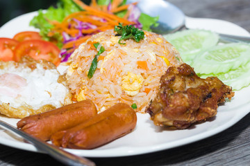 American fried rice on plate on wood table
