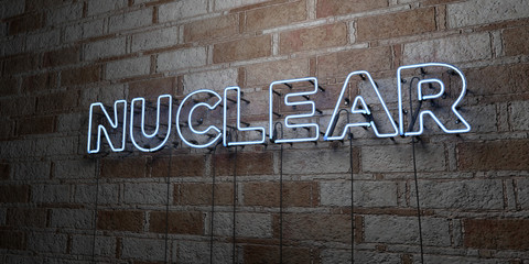 NUCLEAR - Glowing Neon Sign on stonework wall - 3D rendered royalty free stock illustration.  Can be used for online banner ads and direct mailers..
