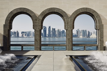 Downtown Doha with its impressive skyline of skyscrapers as seen from the Museum of Islamic Arts, across the bay, Doha, Qatar
