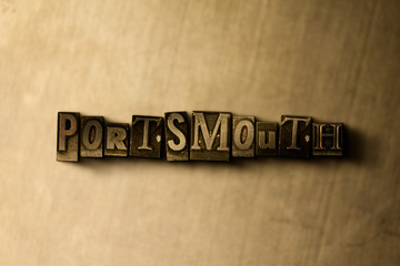 PORTSMOUTH - close-up of grungy vintage typeset word on metal backdrop. Royalty free stock illustration.  Can be used for online banner ads and direct mail.