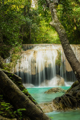 Fototapeta na wymiar Erawan waterfall, the beautiful waterfall in forest at Erawan National Park - A beautiful waterfall on the River Kwai. Kanchanaburi, Thailand