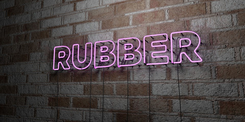 RUBBER - Glowing Neon Sign on stonework wall - 3D rendered royalty free stock illustration.  Can be used for online banner ads and direct mailers..