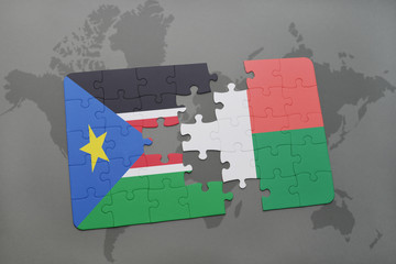 puzzle with the national flag of south sudan and madagascar on a world map